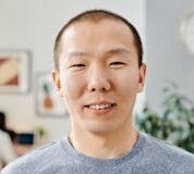 Portrait of a smiling man in a casual indoor setting, perfect for lifestyle themes.